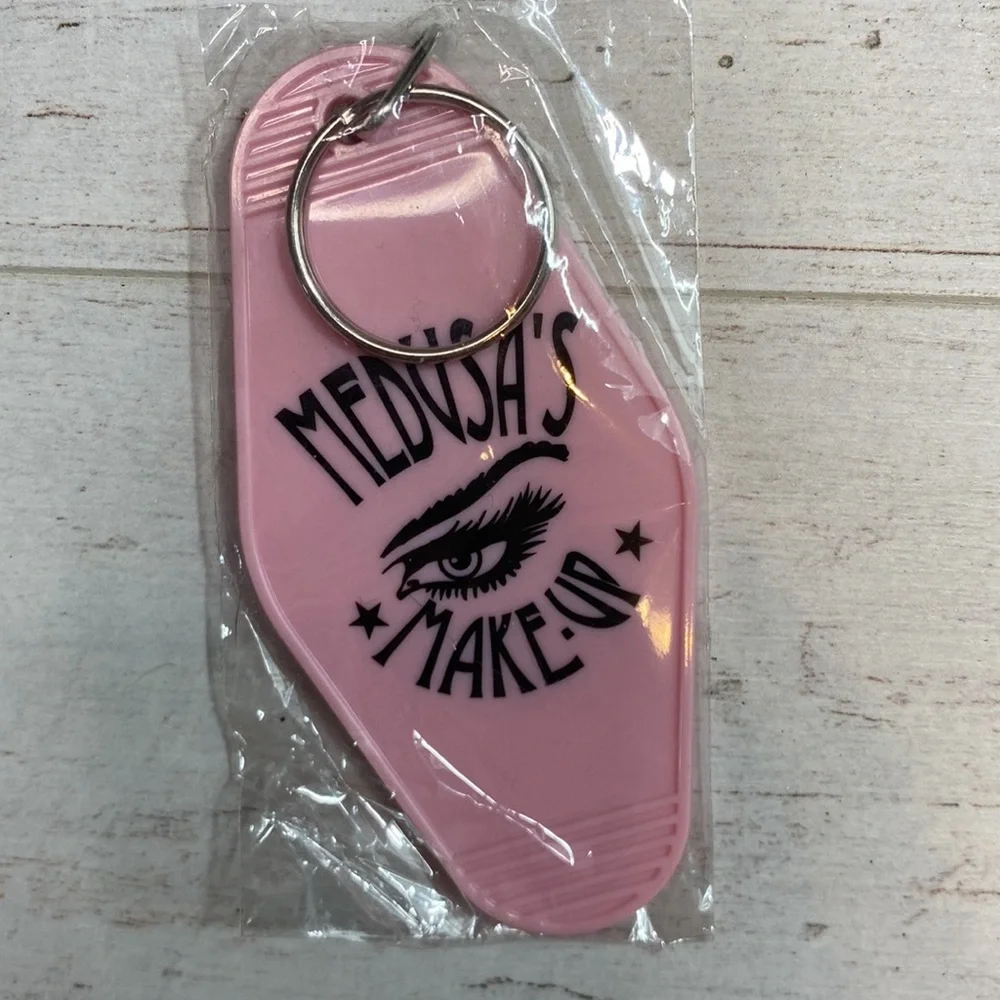 Medusa’s Makeup Light Pink “Escape the Ordinary” Hotel Room Key Chain